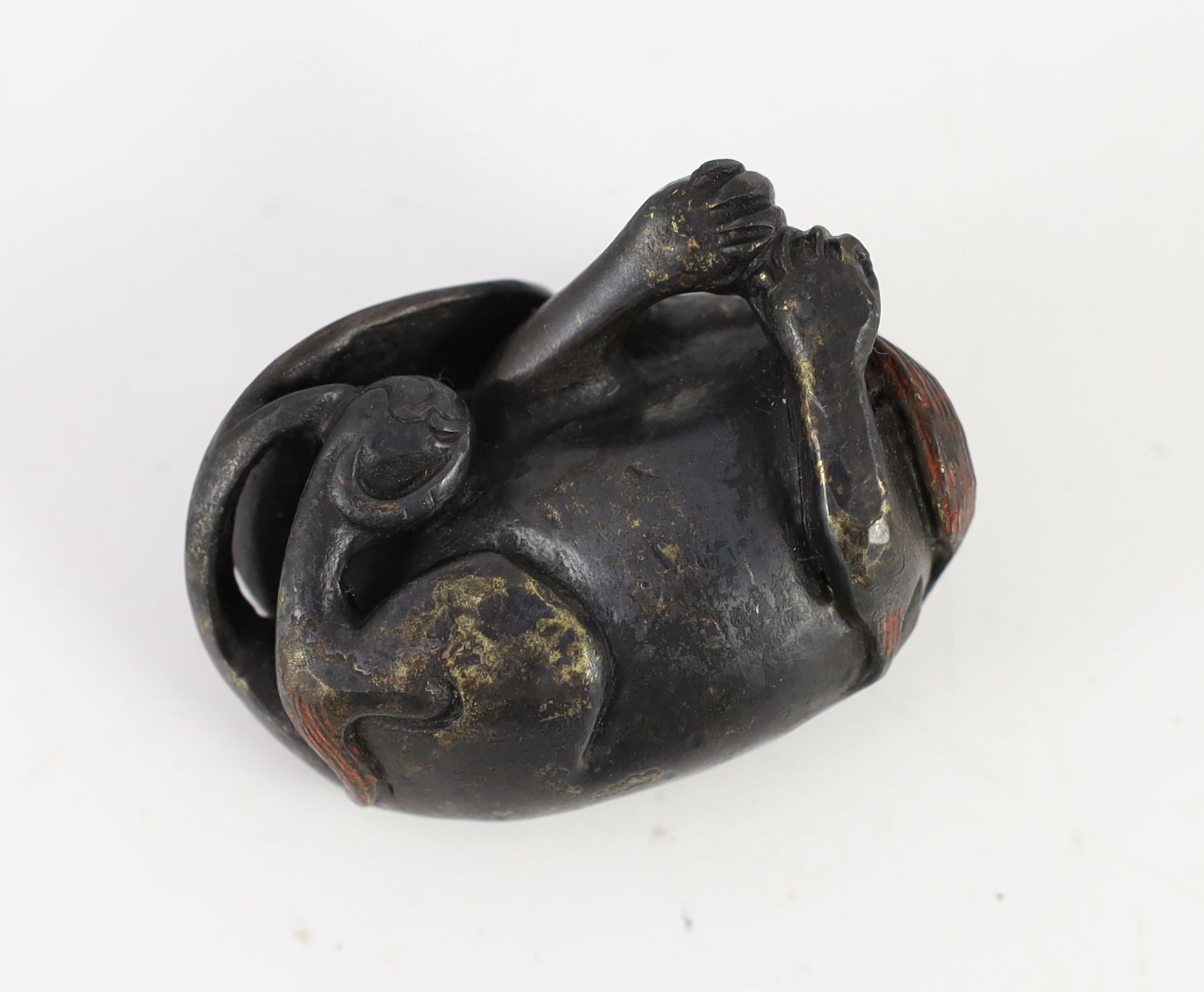 A Chinese bronze ‘lion dog’ scroll weight, Ming or later, 6.4cm long